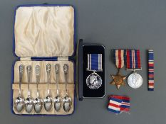 A pair of WWII medals together with a long service and good conduct police medal to Sergeant David