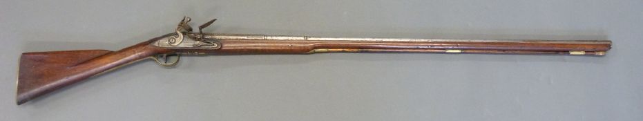 Flintlock hammer action gun with lock named Hallick or Halleck, carved and shaped stock,