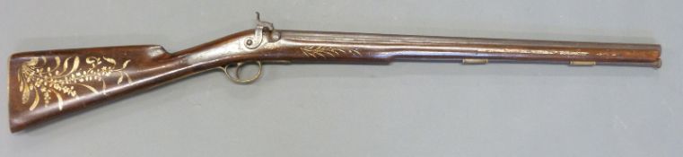 Westwood 16 bore percussion hammer action single barrelled gun with ornately painted stock and