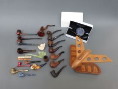 A collection of pipes including boxed Rattray's, Minibert, London Briar, Falcon, jade style etc.