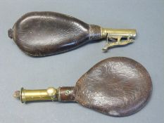 Two leather and brass shot flasks,