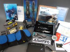A quantity of scuba diving equipment, breathing apparatus, knives, camera,
