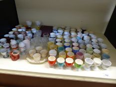 A large collection of egg cups including Spode, Mason's, Art Deco,