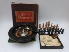 Jeu De Roulette set in original box together with a turned wooden chess set, bezique counter,