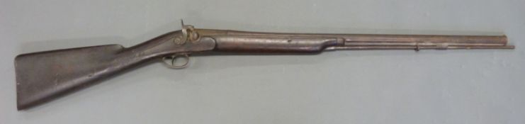 Percussion hammer action gun with Westley Richards named lock, engraved stylised dolphin hammer,