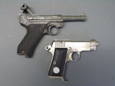 Two replica pistols,