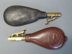 Two leather and brass shot flasks one with embossed decoration of a dog and single suspension loop,