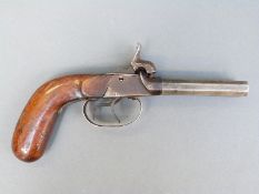 Double barrelled side by side percussion hammer action pistol with shaped mahogany grip,