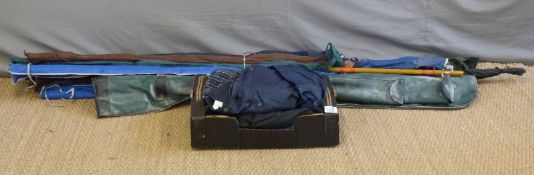A collection of fishing rods including two carbon Shakespeare Sigma sea fishing rods,