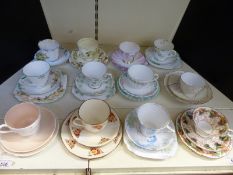A collection of decorative and collectable trios / cups and saucers including Coalport,
