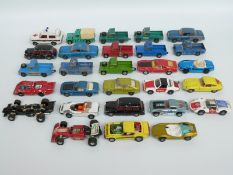 Twenty-eight Corgi Toys Whizzwheels diecast model vehicles including racing cars,