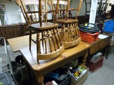 A pine kitchen table and four chairs,