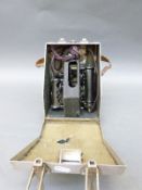 A Mark IX bubble sextant in riveted aluminium case with leather carry handle,