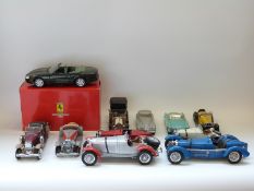 Twelve Franklin Mint, Burago and similar large scale diecast model vehicles,