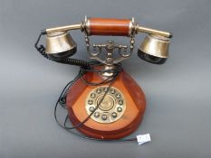 Two reproduction telephones wired for modern use