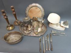 A collection of plated ware including a shaped tray brass candlesticks, cutlery,