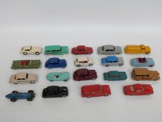 Nineteen Dinky Toys diecast model vehicles including racing cars, fire car, tanker,
