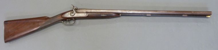 11 bore side by side percussion hammer action gun with engraved locks,