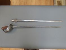 A 1908 pattern WWI Wilkinson sword in metal scabbard