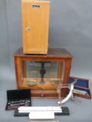 A set of Philip Harris laboratory scales, cased microscope,