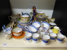 A collection of decorative ceramics including fine bone china trios, tea ware, Coalport, figure,