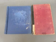 A stamp album and a cigarette card album