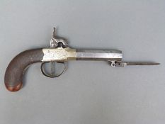 Percussion hammer action pistol with sprung bayonet, engraved lock, stylised dolphin hammer,