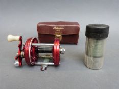 A leather cased Abu Ambassadeur 600 mulitplier fishing reel and spare spool