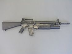 Armalite M15A4 airsoft rifle with grenade launcher,
