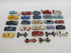 Twenty-seven Corgi diecast model vehicles including Man from UNCLE Oldsmobile Super 88, racing cars,