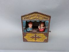 A Punch & Judy mechanical money box,