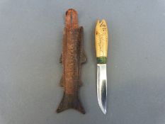 A carved figural fish knife marked OYO Geilo Rustfri to blade and Norefield to handle,