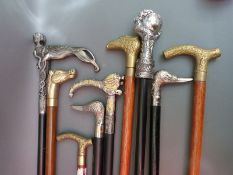 Ten various novelty walking sticks including examples with handles formed as ducks, horses,