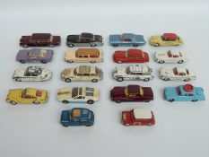 Eighteen Corgi Toys diecast model cars including Mini, Olympics car,