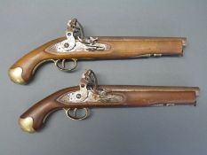 A pair of flintlock hammer action Dragoon-style pistols with locks engraved Tower and crown over GR