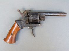 Pin fire hammer action six-shot revolver with three inch octagonal barrel, overall length 19cm.