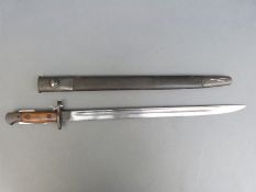 A 1907 pattern Wilkinson bayonet in scabbard