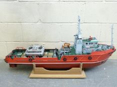 A large remote controlled model boat on stand, in fitted wooden box,