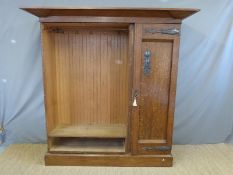 An oak Arts and Crafts or Art Nouveau wardrobe with beaten copper fittings,