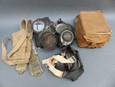 Three various WWII gas masks including one with provenance relating to a District Nurse