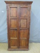 A stained hardwood cupboard,