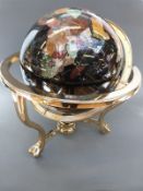 A pietra dura globe with black sea