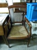 A 19thC / early 20thC armchair with slat back