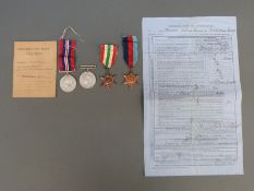 A boxed set of four WWII medals comprising 1939-45 Medal, defence medal, Italy star and 37-45 star,