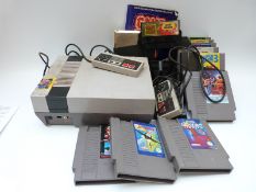 Nintendo NES games console with 11 various games