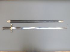 A 19thC Wilkinson 'handkerchief cutter' sword with leather scabbard.