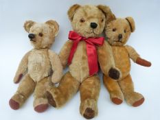 Three various mohair Teddy bears all with orange and black glass eyes,