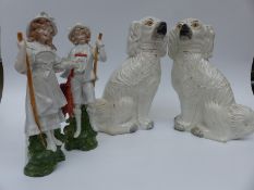 A pair of Staffordshire dogs and two figures