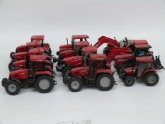 Twelve Britains and similar 1:32 scale diecast and plastic model Case tractors,