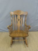 An elm seated rocking chair